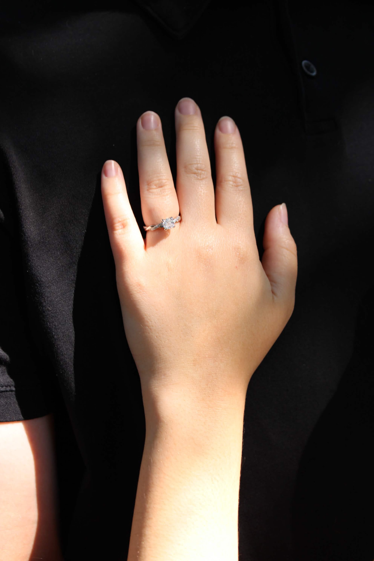 Close detail of an engagement ring on a hand